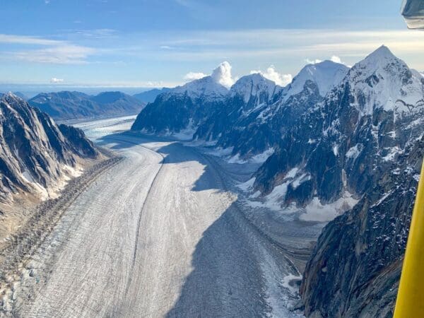 Snowy mountains with a winding glacier valley.