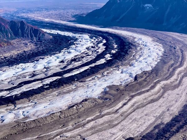 Aerial view of a glacier and mountains.