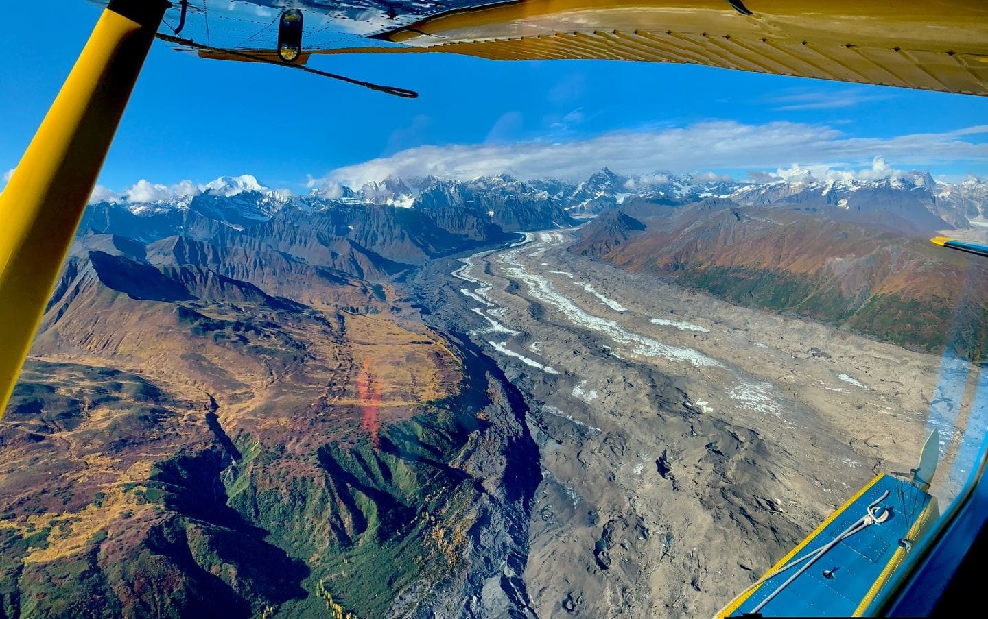 Aerial view of mountains and glacier landscape.